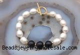 CFB975 Hand-knotted 9mm - 10mm rice white freshwater pearl & black agate bracelet