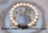 CGB6490 8mm round matte white fossil jasper & black lava beaded bracelets